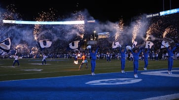 A BYU cheerleading coach collapsed after being hit with a water bottle during a game in Utah, and a fan was arrested.