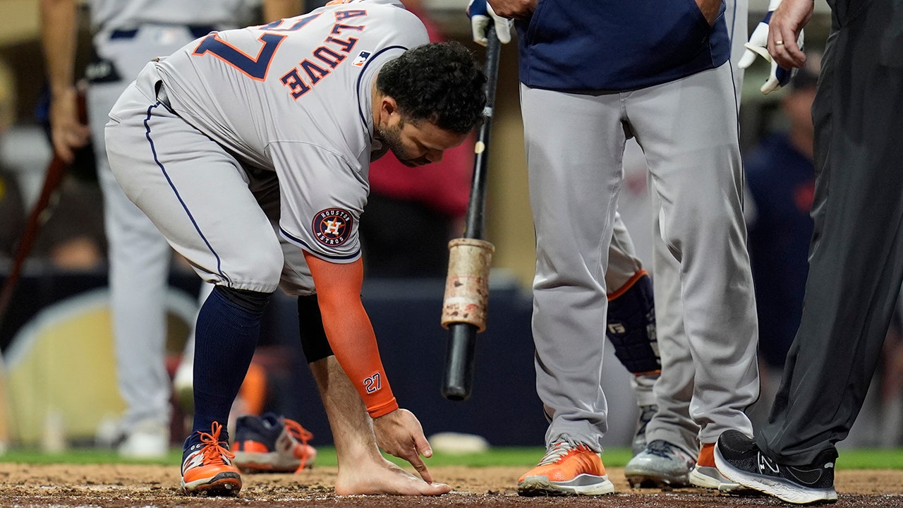 Jose Altuve of the Astros was ejected in a wild scene after removing his sock and cleat. "They missed that call," he said.