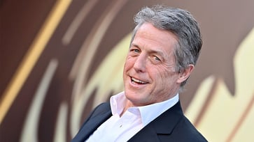 At 64 years old, Hugh Grant acknowledges the difficulties of being a father in his age, humorously remarks about the 'unbearable' aspect of playtime.