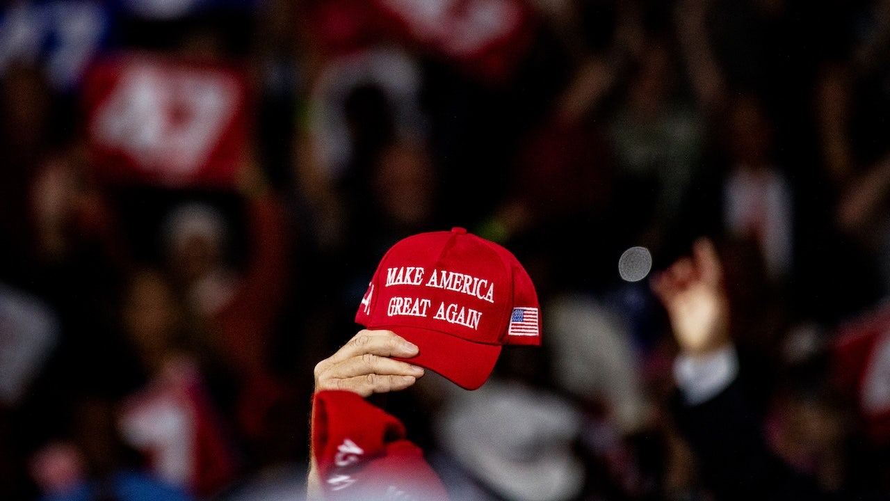 Cardinals staff apologizes for misunderstanding after woman is forced to discard MAGA hat at game.