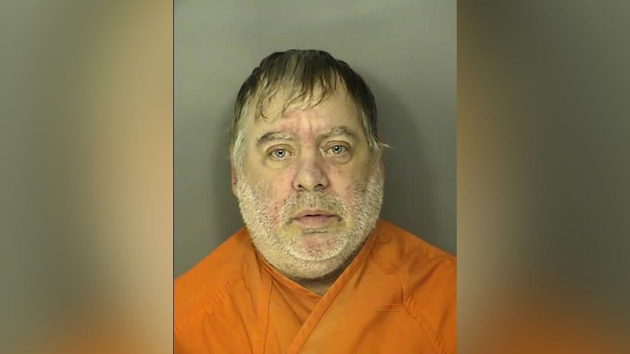 Police charge South Carolina man with murder after discovering roommate's remains under fire pit.