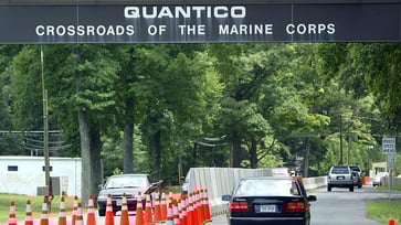 Two foreign nationals are in ICE custody following an attempted breach at a significant Marine base.