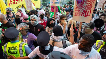 DEMONSTRATIONS BREAK OUT: Shops secure their windows near the DNC in Chicago