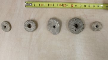 New insights about the wheel could be gained from the discovery of 12,000-year-old pebbles by archaeologists.