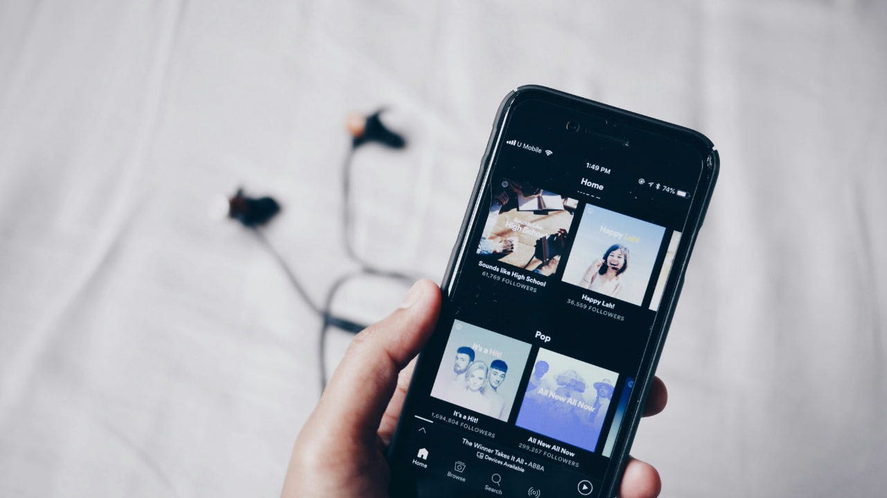 Pirated software and scams are being promoted through the hijacking of Spotify playlists.