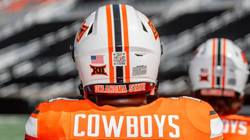 NIL fund linked to QR codes on Oklahoma State football players' helmets.