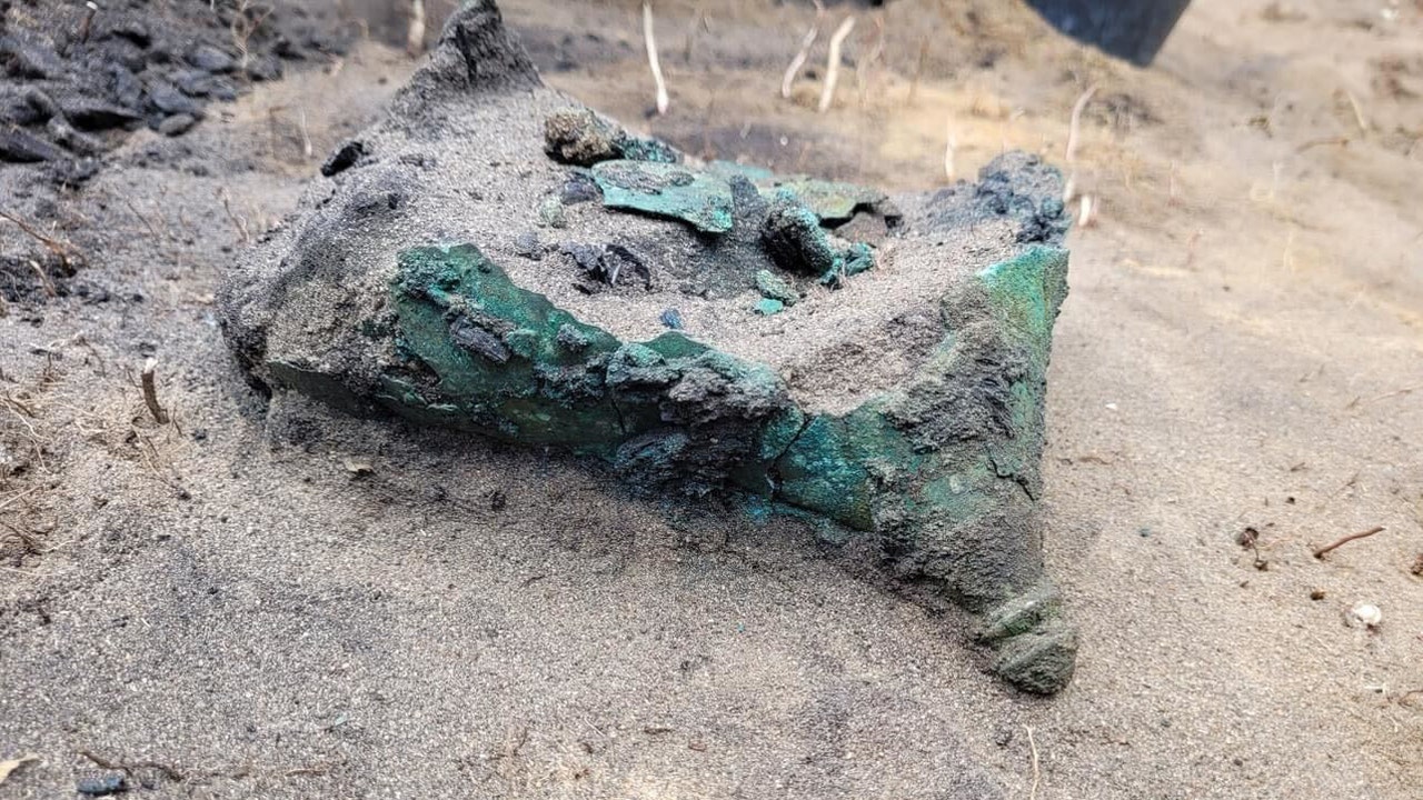 An ancient Celtic artifact, a 2,300-year-old metal object, was discovered in Poland, extracted from a charcoal pit.