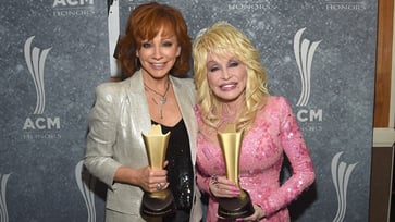 Reba McEntire has never met Dolly Parton's mysterious spouse, Carl.